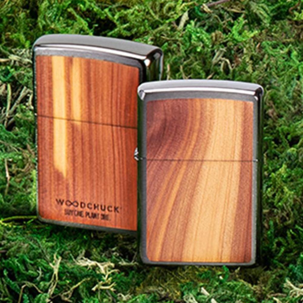 Woodchuck USA Cedar Windproof Lighter on grass background