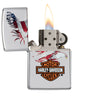 Harley-Davidson® Eagle American Flag High Polish Chrome Windproof Lighter with its lid open and lit