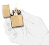 29609 Golden Paisley Zippo Design on a High Polish Brass Lighter - In Hand, Open Lit