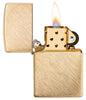 Classic Herringbone Sweep Brass Windproof Lighter with its lid open and lit