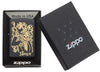 Front view of the Joke Skeleton Tipping Hat with Bronze Swirls on Black Matte Lighter in the one box packaging 