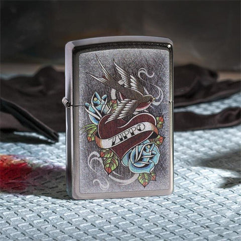 Vintage Tattoo Zippo Windproof Lighter on grey and black background