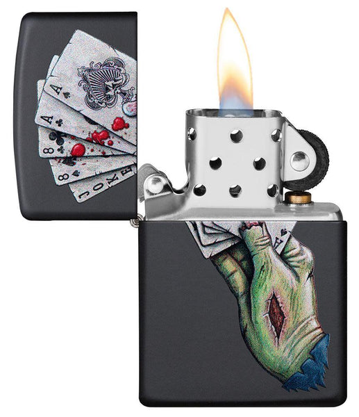 Dead Mans Hand Design Black Matte Windproof Lighter with its lid open and lit