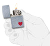 Front view of the Red Heart Love Design Lighter in hand, open and lit