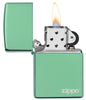 Classic High Polish Green Zippo Logo Windproof Lighter with its lid open and lit