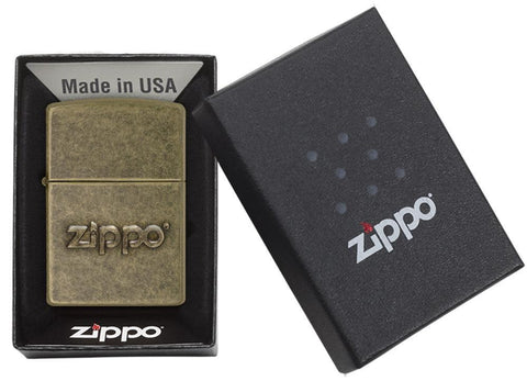 Zippo Stamp Antique Brass Lighter in its packaging