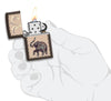 Lucky Elephant Design Windproof Pocket Lighter lit in hand.