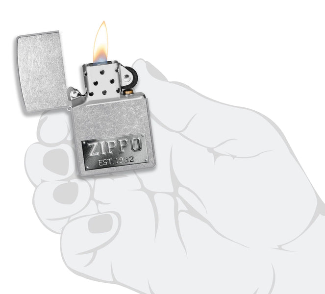 Zippo Design Windproof Lighter lit in hand.