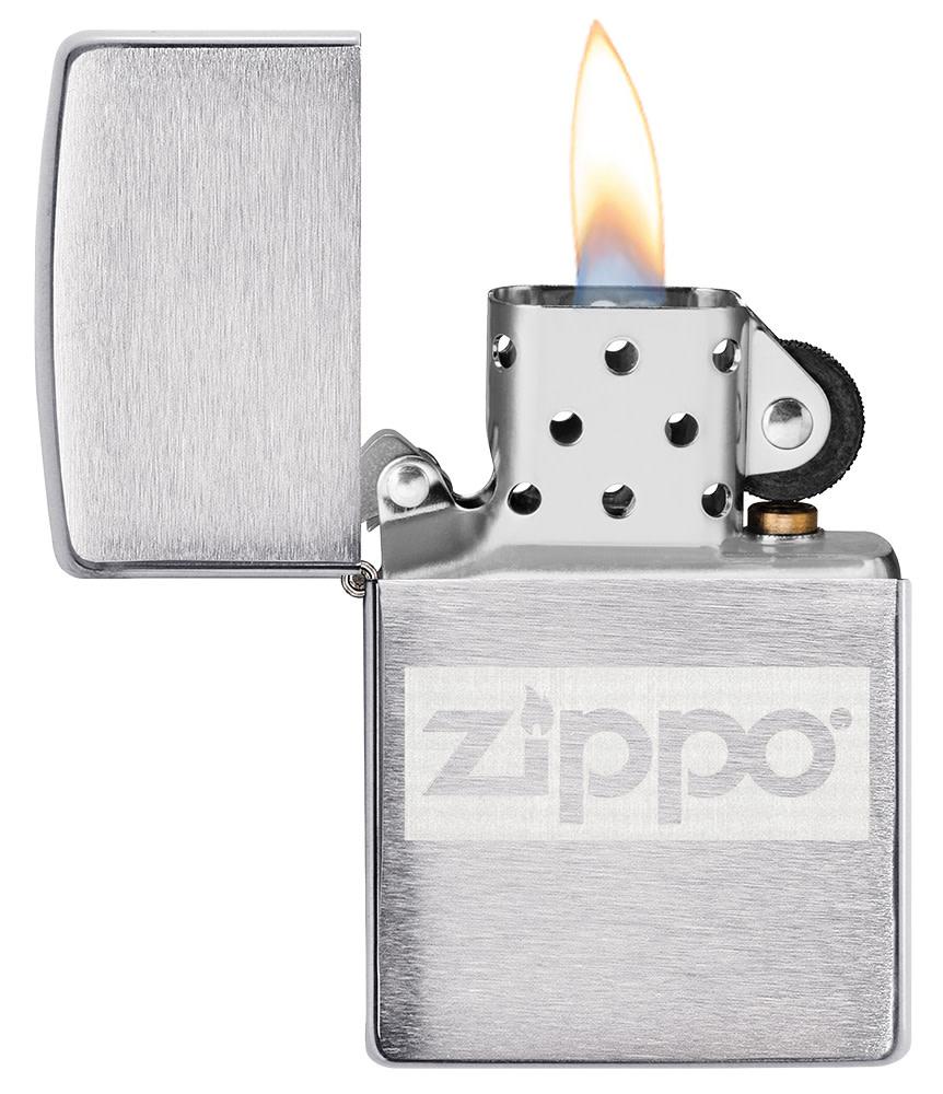 Brushed Chrome Zippo logo windproof lighter with its lid open and lit