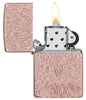 Zippo Carved Armor® Rose Gold Design Windproof Lighter with its lid open and lit.