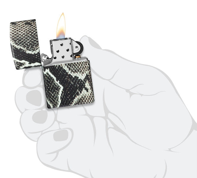 Snake Skin Design 540 Color Windproof Lighter lit in hand.