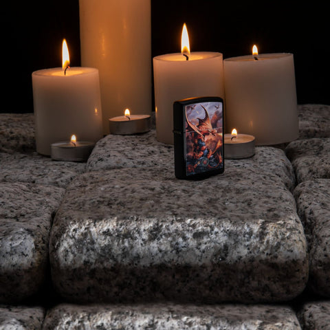 Lifestyle image of Anne Stokes Fire Breathing Dragon Lighter standing on cobblestone with lit candles in the background