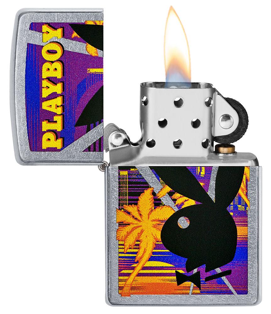 Playboy Beach Rabbit Head Street Chrome™ Windproof Lighter with its lid open and lit.