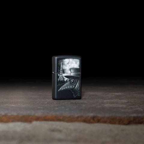 Lifestyle image of Plague of Disinformation Black Matte Windproof Lighter standing on a stone slab with a black background