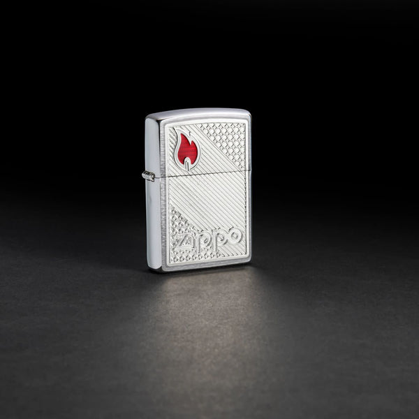 Lifestyle image of Zippo Tiles Emblem Design Brushed Chrome Windproof Lighter standing in a black background.