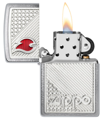 Zippo Tiles Emblem Design Brushed Chrome Windproof Lighter with its lid open and lit.