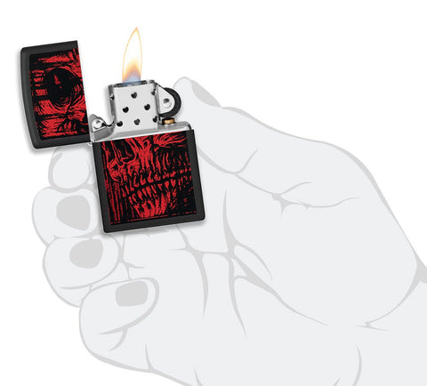 Red Skull Design Black Matte Windproof Lighter lit in hand.